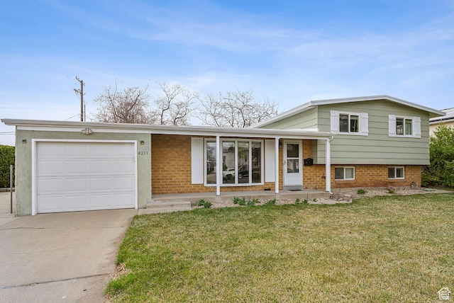 tri-level home featuring a front lawn, a garage, brick siding, and concrete driveway