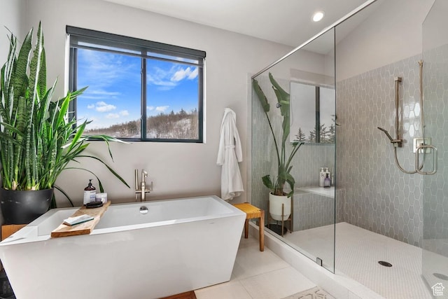 8680 Saddleback Cir, Park City, UT 84098 - bathroom featuring plenty of natural light, a stall shower, a freestanding tub, and tile patterned flooring