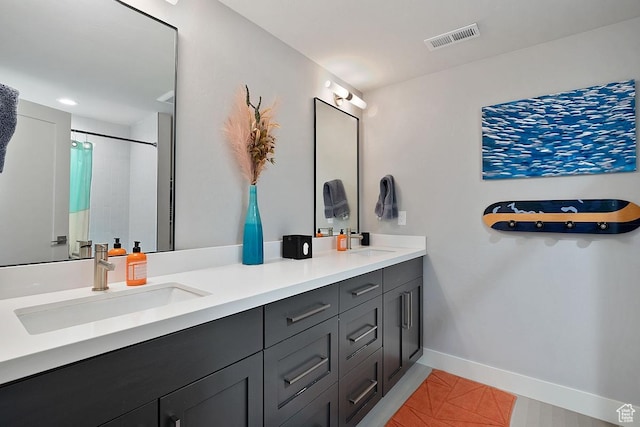 8680 Saddleback Cir, Park City, UT 84098 - bathroom featuring double vanity, tile patterned flooring, baseboards, and a shower with shower curtain