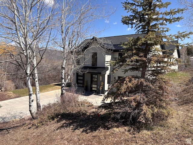 8680 Saddleback Cir, Park City, UT 84098 - view of property exterior with roof with shingles and stucco siding