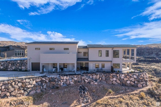 599 W 170 S, La Verkin, UT 84745 - rear view of property with stucco siding, driveway, a mountain view, and a patio area