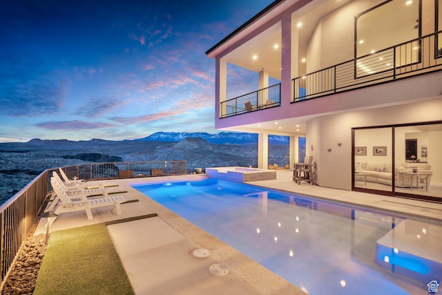 599 W 170 S, La Verkin, UT 84745 - view of swimming pool with a pool with connected hot tub, a mountain view, fence, and a patio area
