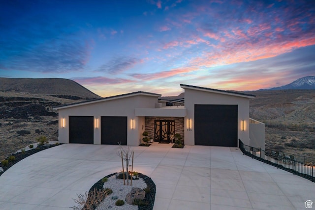 599 W 170 S, La Verkin, UT 84745 - modern home with concrete driveway, stucco siding, fence, a mountain view, and a garage