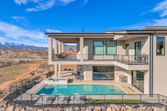 599 W 170 S, La Verkin, UT 84745 - back of house featuring stucco siding, a mountain view, a patio, and a balcony