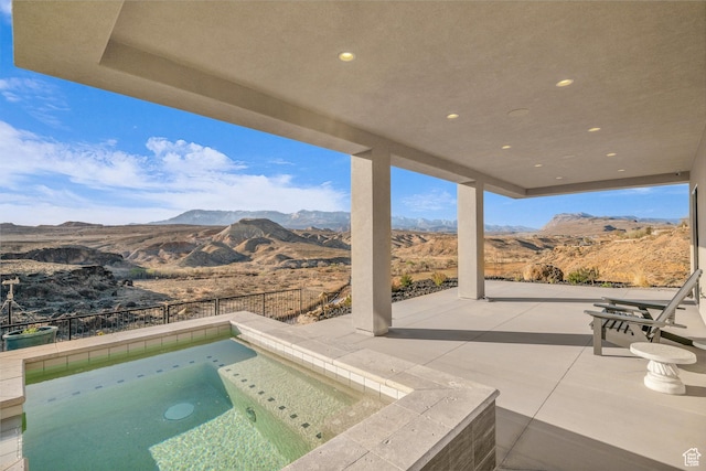 599 W 170 S, La Verkin, UT 84745 - view of swimming pool featuring an in ground hot tub, a mountain view, and a patio