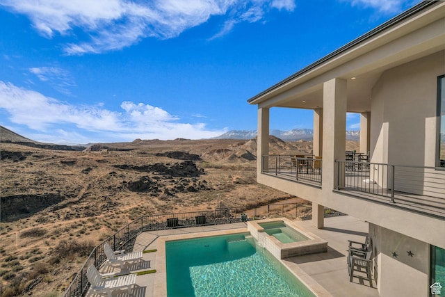 599 W 170 S, La Verkin, UT 84745 - view of pool featuring fence, a pool with connected hot tub, a patio, and a mountain view