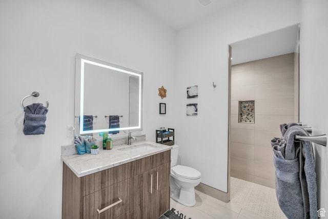 599 W 170 S, La Verkin, UT 84745 - bathroom featuring a tile shower, toilet, tile patterned floors, and vanity