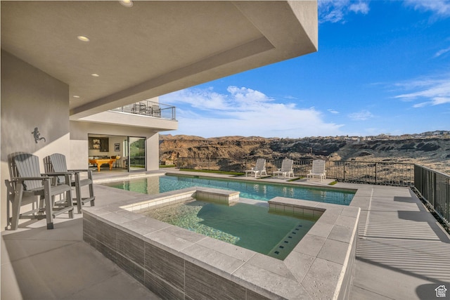 599 W 170 S, La Verkin, UT 84745 - view of swimming pool with a patio, a mountain view, and a pool with connected hot tub