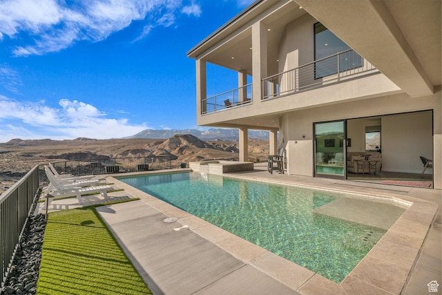 599 W 170 S, La Verkin, UT 84745 - view of swimming pool featuring a pool with connected hot tub, a mountain view, fence, and a patio area
