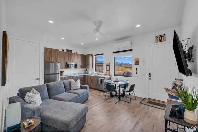 599 W 170 S, La Verkin, UT 84745 - living area with light wood-style flooring, baseboards, ceiling fan, recessed lighting, and a wall unit AC