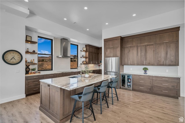 599 W 170 S, La Verkin, UT 84745 - kitchen with a sink, freestanding refrigerator, open shelves, wall chimney exhaust hood, and light wood-style flooring