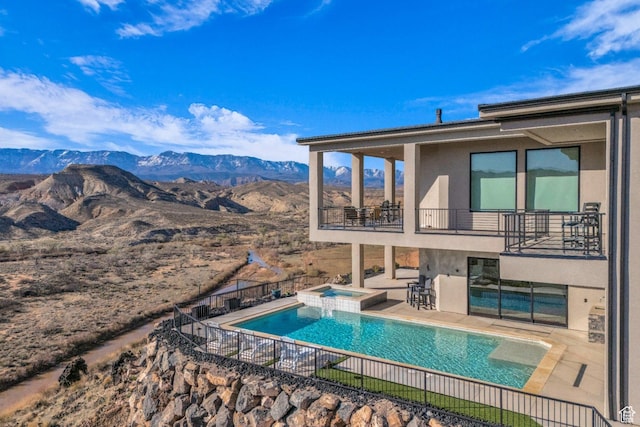 599 W 170 S, La Verkin, UT 84745 - view of pool with a pool with connected hot tub, a mountain view, fence, and a patio area