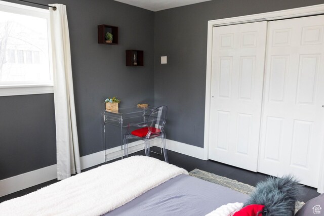 301 E 2700 S Unit 16, South Salt Lake, UT 84115 - bedroom with baseboards and a closet