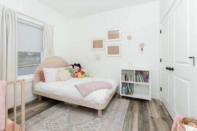 602 W 20 N, Hyrum, UT 84319 - bedroom featuring baseboards and wood finished floors