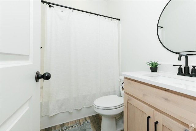 602 W 20 N, Hyrum, UT 84319 - bathroom featuring shower / tub combo, wood finished floors, toilet, and vanity