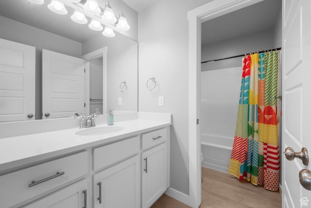 13099 S Twisted Oak Dr, Herriman, UT 84096 - full bathroom with baseboards, shower / bath combination with curtain, wood finished floors, and vanity