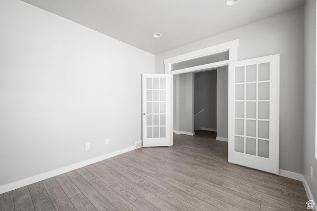 13099 S Twisted Oak Dr, Herriman, UT 84096 - empty room with baseboards, wood finished floors, and french doors