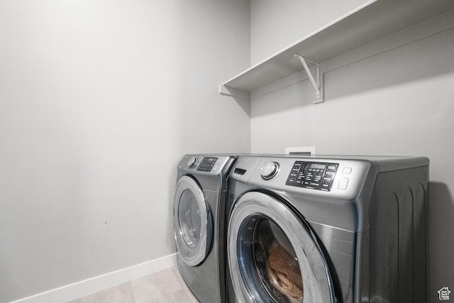 13099 S Twisted Oak Dr, Herriman, UT 84096 - clothes washing area featuring baseboards, laundry area, and washer and clothes dryer