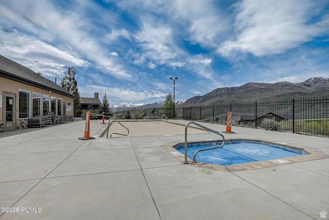 5265 N Laurelwood St N, Heber City, UT 84032 - view of swimming pool with a patio area, a mountain view, fence, and a hot tub