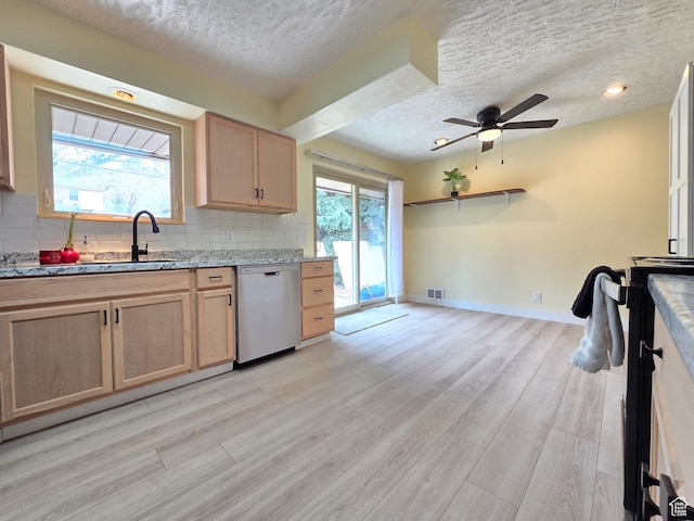 2084 Robins Ave, Ogden, UT 84401 - kitchen with dishwasher, a textured ceiling, light brown cabinets, decorative backsplash, and light wood-style floors