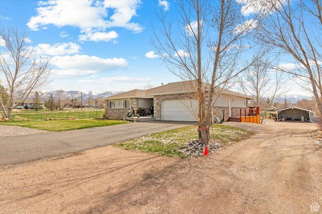 170 E 400 N, Mount Pleasant, UT 84647 - view of front of home featuring fence, a mountain view, a garage, driveway, and a detached carport
