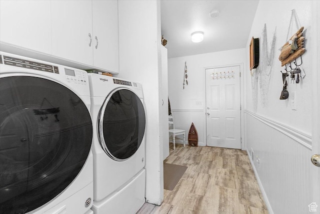 170 E 400 N, Mount Pleasant, UT 84647 - laundry room with light wood-style flooring, cabinet space, washing machine and dryer, and wainscoting