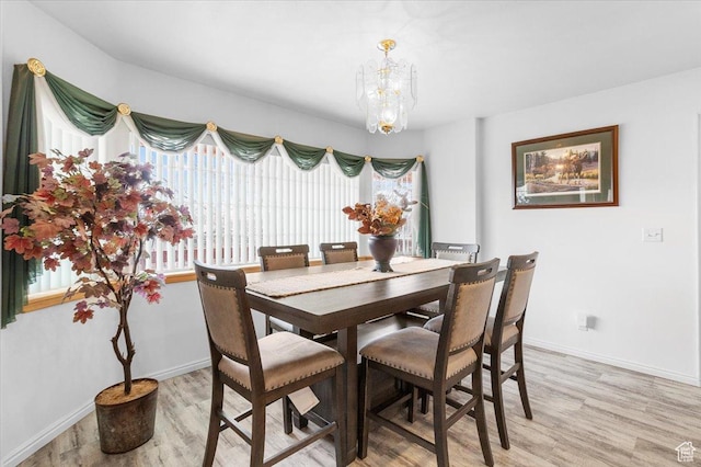 170 E 400 N, Mount Pleasant, UT 84647 - dining space featuring baseboards, light wood-style flooring, and a chandelier