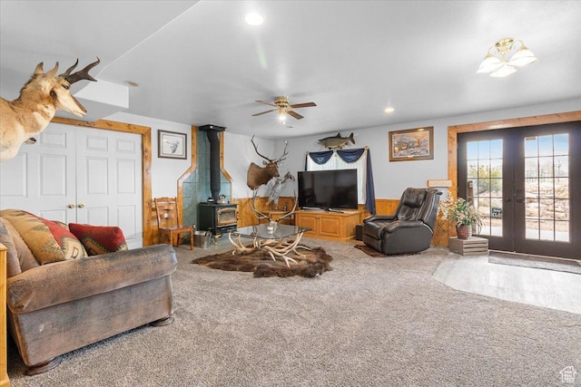 170 E 400 N, Mount Pleasant, UT 84647 - living room featuring french doors, recessed lighting, a ceiling fan, carpet floors, and a wood stove