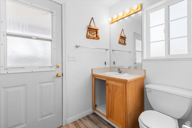 170 E 400 N, Mount Pleasant, UT 84647 - half bathroom with baseboards, toilet, vanity, and wood finished floors