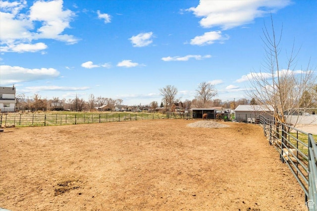170 E 400 N, Mount Pleasant, UT 84647 - view of yard featuring an enclosed area, an outdoor structure, an exterior structure, and a rural view