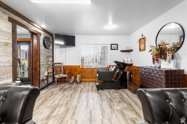170 E 400 N, Mount Pleasant, UT 84647 - living area featuring a wainscoted wall, wooden walls, and wood finished floors