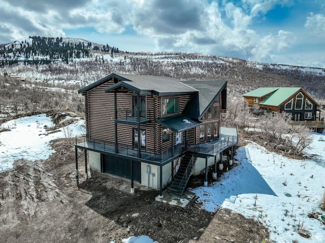 2032 Timber Lakes Dr Unit 950, Heber City, UT 84032 - snow covered property featuring driveway, stairway, and log exterior