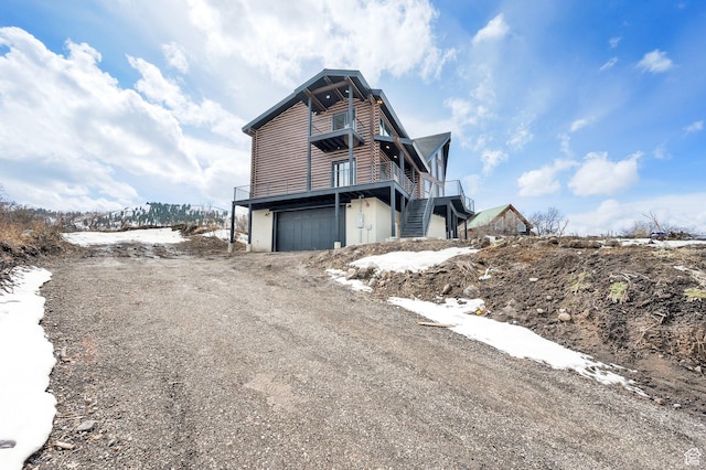 2032 Timber Lakes Dr Unit 950, Heber City, UT 84032 - view of property exterior with dirt driveway, stairs, and a garage