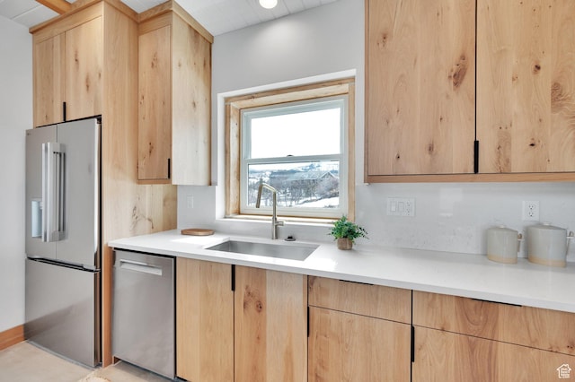 2032 Timber Lakes Dr Unit 950, Heber City, UT 84032 - kitchen with a sink, light countertops, light brown cabinetry, and stainless steel appliances