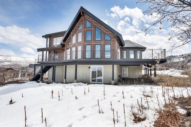 2032 Timber Lakes Dr Unit 950, Heber City, UT 84032 - snow covered property featuring stucco siding and stairway