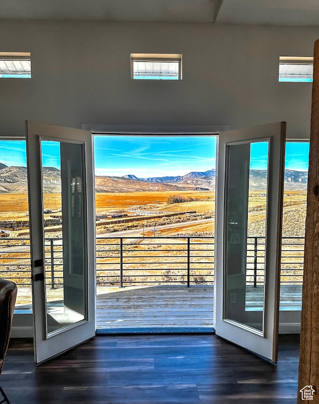 690 N Main St, Antimony, UT 84712 - doorway with a healthy amount of sunlight, a mountain view, and wood finished floors