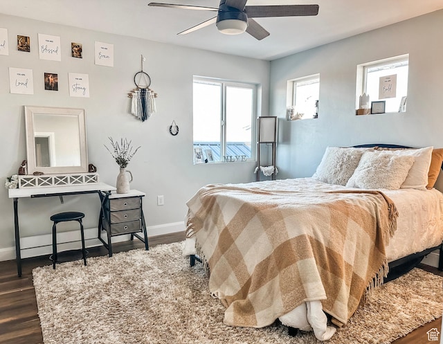 690 N Main St, Antimony, UT 84712 - bedroom featuring baseboards, ceiling fan, and dark wood-style flooring