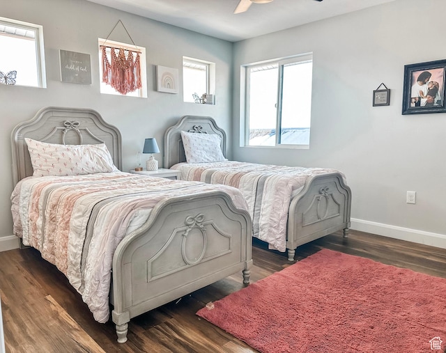 690 N Main St, Antimony, UT 84712 - bedroom featuring dark wood-style floors, baseboards, and ceiling fan