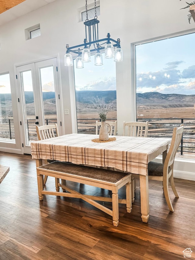 690 N Main St, Antimony, UT 84712 - dining area with baseboards, dark wood-style floors, and a mountain view