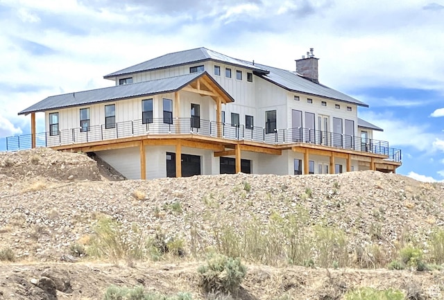 690 N Main St, Antimony, UT 84712 - back of property with board and batten siding, metal roof, and a chimney