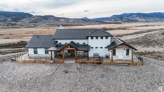 690 N Main St, Antimony, UT 84712 - rear view of property with a deck with mountain view and metal roof