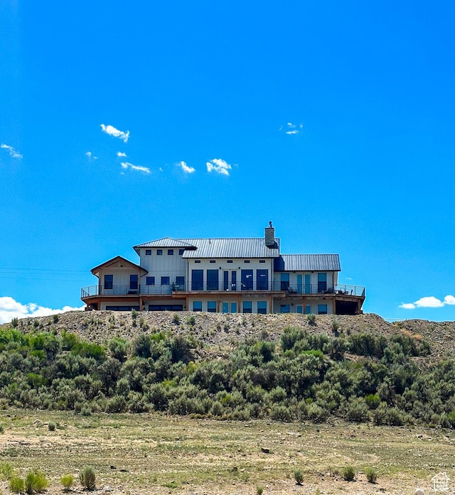 690 N Main St, Antimony, UT 84712 - rear view of house with a chimney and metal roof