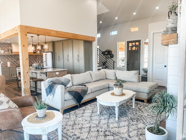 690 N Main St, Antimony, UT 84712 - living room with a high ceiling, wood finished floors, stairway, and recessed lighting