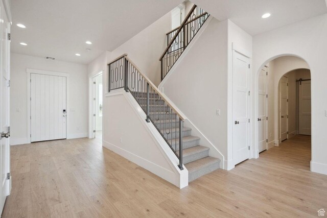 3087 E 2220 S, St George, UT 84790 - entrance foyer featuring arched walkways, wood finished floors, recessed lighting, and baseboards