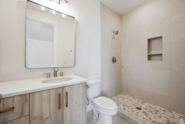 3087 E 2220 S, St George, UT 84790 - bathroom with toilet, vanity, and a tile shower