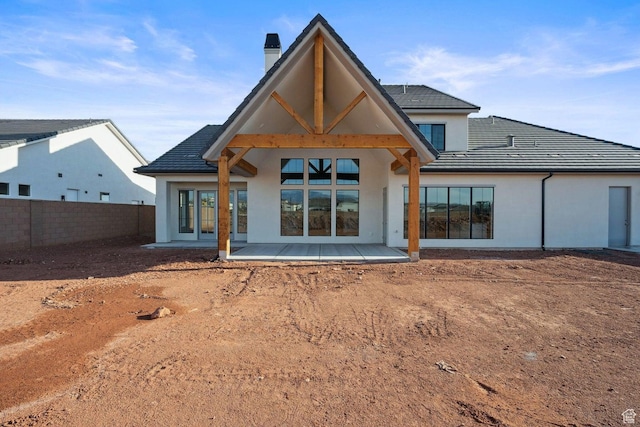 3087 E 2220 S, St George, UT 84790 - back of house featuring a patio area, a chimney, and stucco siding