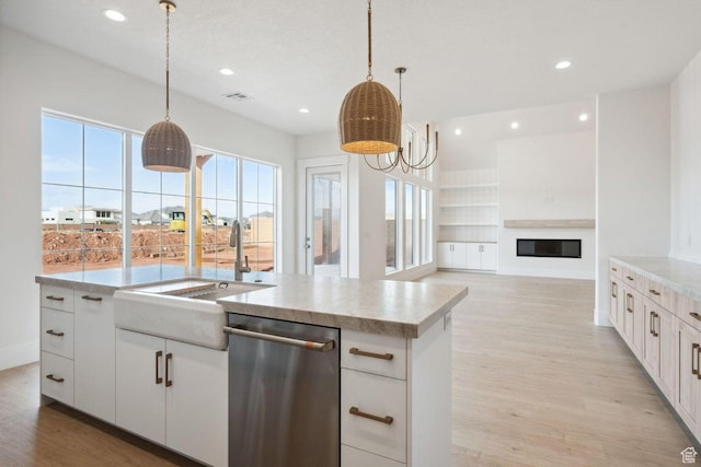 3087 E 2220 S, St George, UT 84790 - kitchen featuring dishwasher, a sink, light wood finished floors, healthy amount of natural light, and recessed lighting