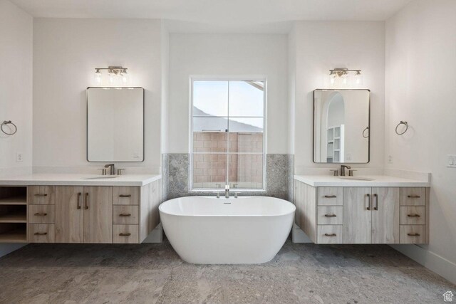3087 E 2220 S, St George, UT 84790 - bathroom featuring a freestanding tub and two vanities