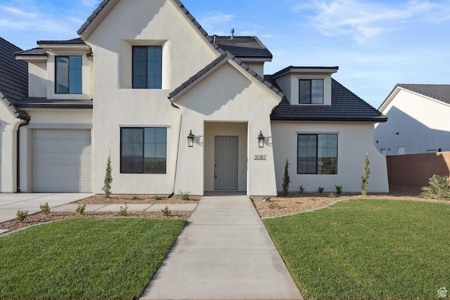 3087 E 2220 S, St George, UT 84790 - french country inspired facade featuring stucco siding, a garage, and driveway