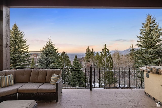 1562 E Granite Brook Ct S, Draper, UT 84020 - patio terrace at dusk featuring an outdoor living space and a balcony